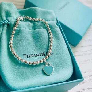 Tiffany & Co. Silver Bead Bracelet with Blue Heart Charm